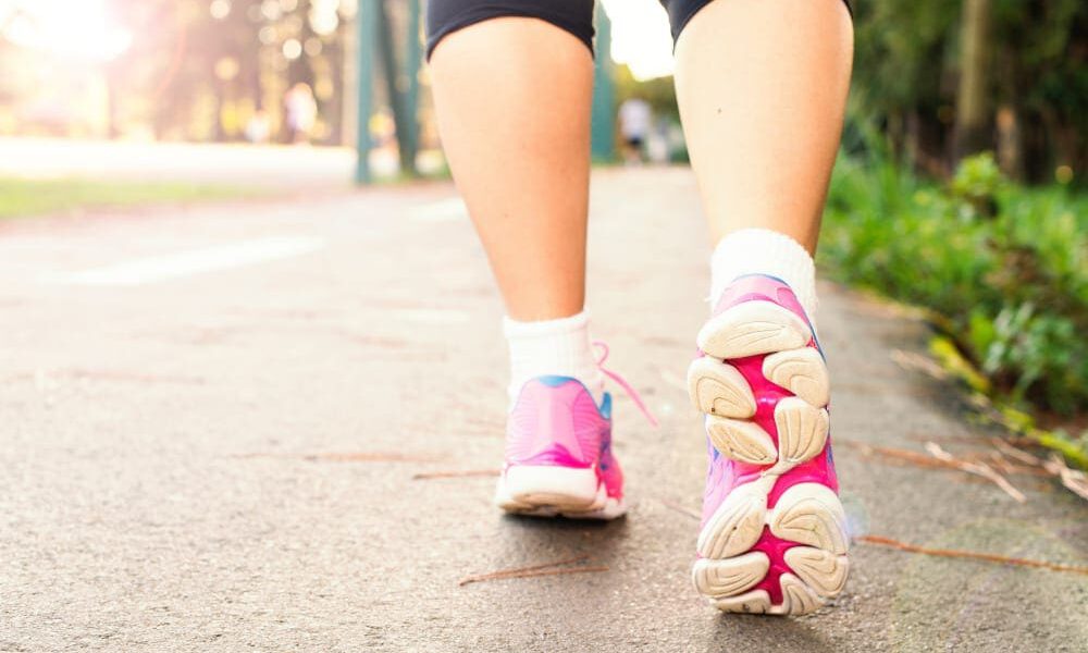 Close up of women's legs walking in the park.