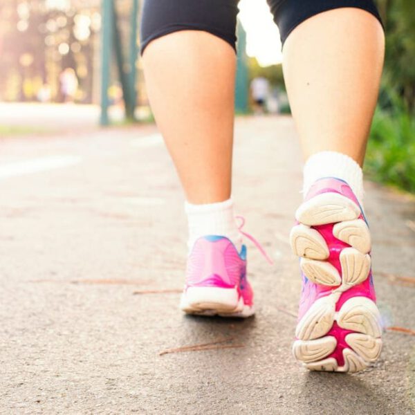 Close up of women's legs walking in the park.