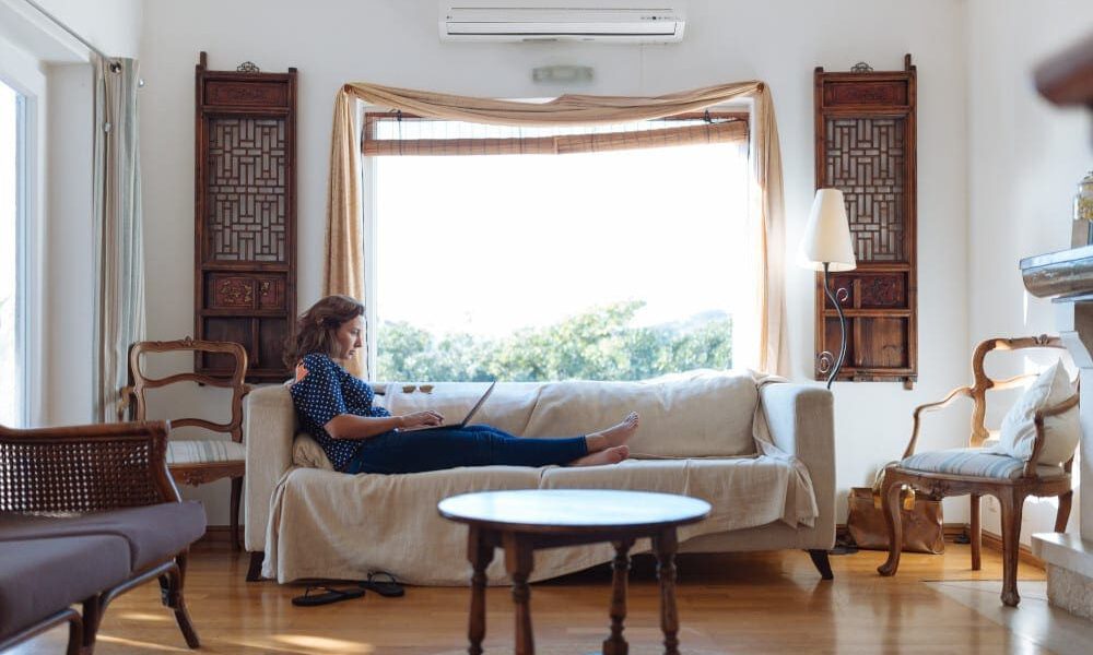 Woman relaxing on a sofa in the living room.