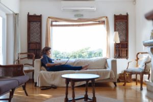 Woman relaxing on a sofa in the living room.