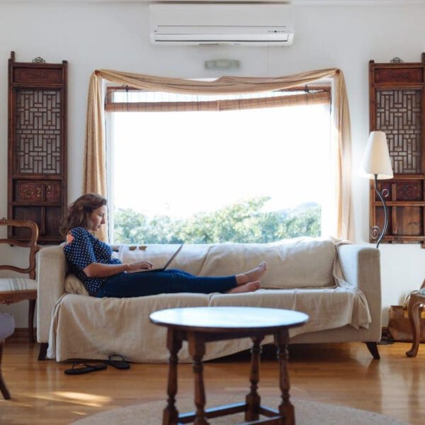 Woman relaxing on a sofa in the living room.