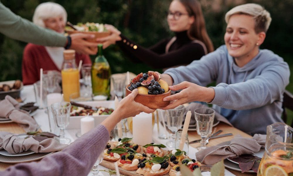 family at dinner table outside