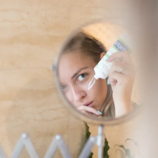 woman applying face cream