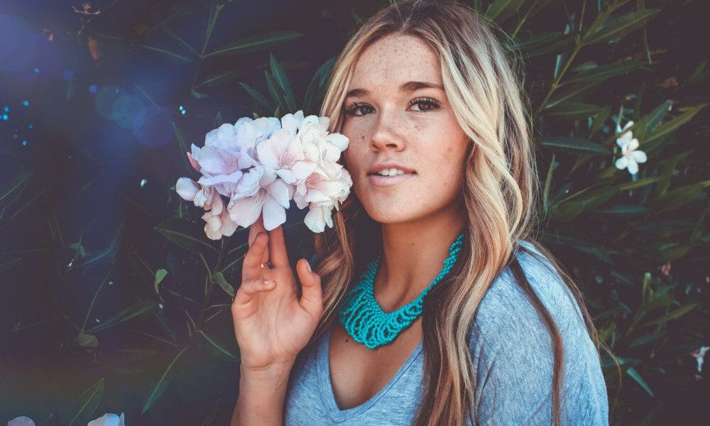 woman holding a flower