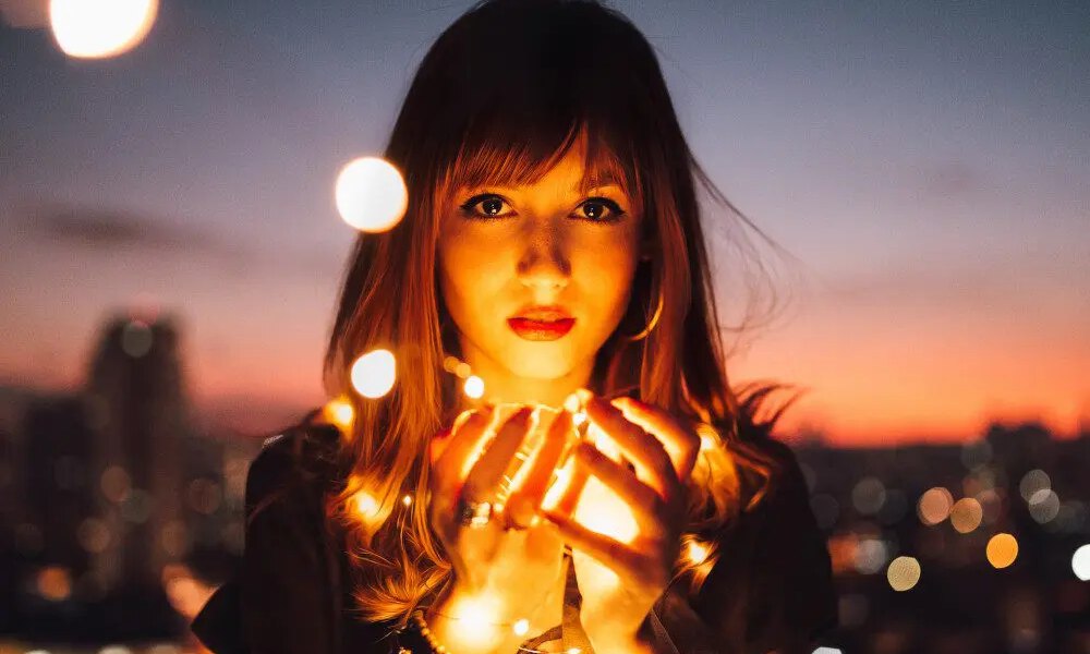 woman holding glowing light