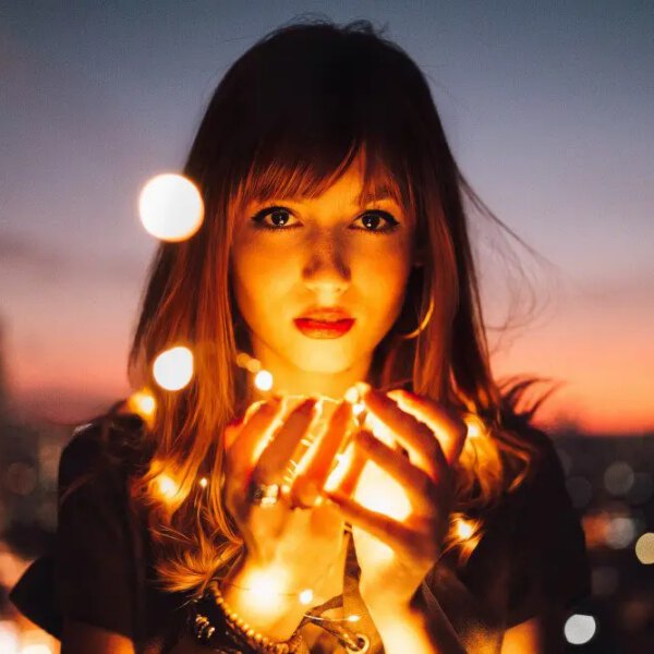 woman holding glowing light